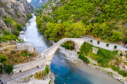 Traditional Stone Bridge in Konitsa The Grand Single Arch Bridge at the Entrance of Aoos Gorge Historic Landmark and Scenic Nature in Greece Featuring Picturesque Views and Cultural Significance