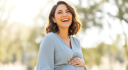 A radiant expectant mother beams with joy while gently cradling her baby bump in a sun-drenched outdoor setting, filled with the warmth of nature and future anticipation