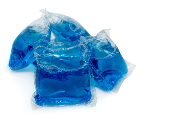 A blue laundry detergent capsule on a white background. Washing machine capsule isolate.