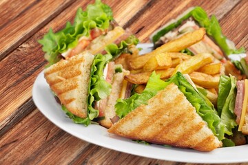 Tasty fresh club sandwich on plate