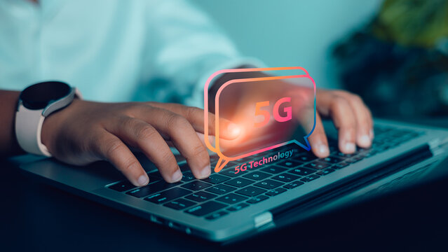 Hands typing on laptop with 5G technology concept for fast internet and digital communication - Powered by Adobe