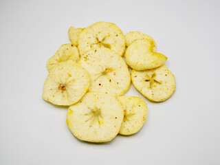 Delicious apple chips with crunchy texture and natural sweetness. Perfect for concepts of vegan snack, organic fruit, low-calorie diet, and clean eating habits