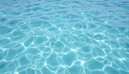 Obraz premium Sunlight reflecting on clear, turquoise ocean water.