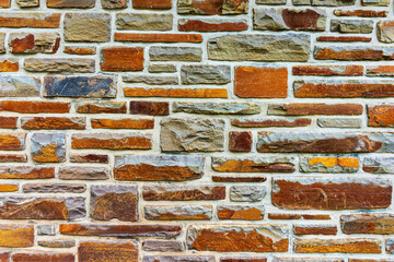 Colorful stone wall useful for backgrounds. Stone wall texture