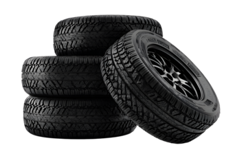 Set of four black car tires stacked against white background, perfect for automotive and vehicle maintenance visuals
