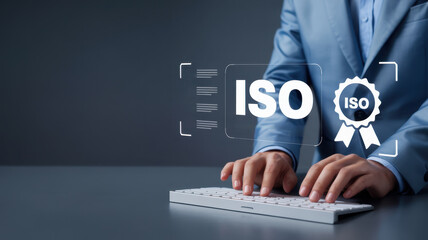 Businessman using keyboard with iso standard certification quality control system assurance concept, guarantee, and standardization organization