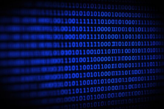 Blue Binary Code Displayed in Rows on a Dark Digital Screen technology programming