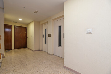 Service staircase with porcelain stoneware steps, steel handrail, and automatic lighting