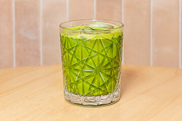 Set of Asian summer drinks, including a to-go cup with a matcha latte, on a white background in...