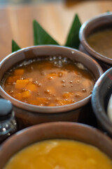 Indonesian traditional sweet potato porridge in clay bowl