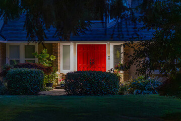 Entrance of luxury house with nice green Summer landscape at night in Vancouver, Canada, North America. August 2025