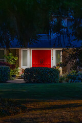Entrance of luxury house with nice green Summer landscape at night in Vancouver, Canada, North America. August 2025