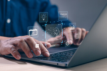 Businessman using AI technology on laptop to boost productivity, manage tasks and automate workflow. Innovation concept of artificial intelligence in modern digital workplace