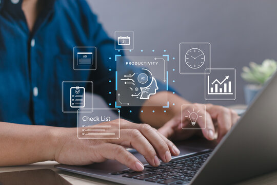 Businessman working on laptop using AI to improve productivity, manage time, and automate tasks. Digital transformation and business technology in modern professional workplace