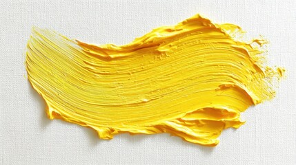 The vibrant yellow paint stroke on a textured canvas background.