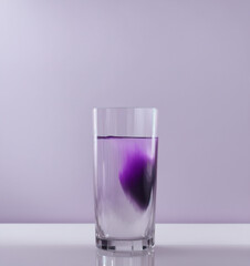 Glass of water with purple gradient effect
