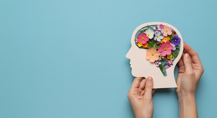 Conceptual Mental Wellness: Hands Holding a Human Head Filled with Colorful Flowers