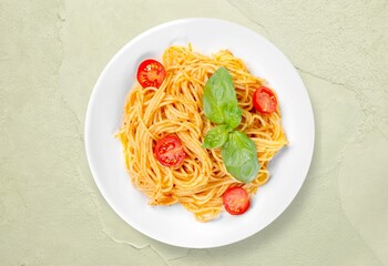 Tasty Spaghetti noodles dish with Sauce and Basil