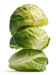 Fototapeta premium Stack of fresh green cabbage heads. Closeup of natural leafy vegetables with layered texture on white background.