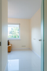 Cozy Living Room Interior with Modern Sofa and Large Sunlit Window
