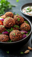 Closeup of Falafel in a Bowl with Red Onion and Tzatziki Sauce