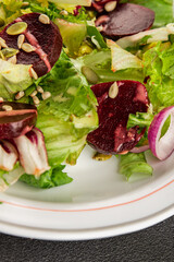 Beet salad green leaf lettuce vegetables natural product tasty snack fresh delicious gourmet food background on the table rustic top view copy space keto and paleo diet vegan and vegan food