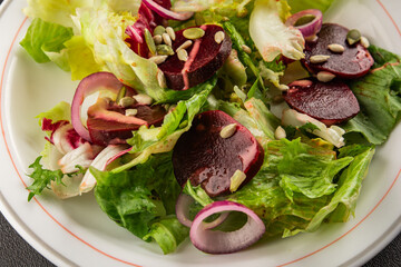 Beet salad green leaf lettuce vegetables natural product tasty snack fresh delicious gourmet food background on the table rustic top view copy space keto and paleo diet vegan and vegan food