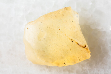 sample of rough libyan desert glass on white