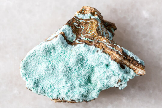 sample of raw aurichalcite mineral on white marble