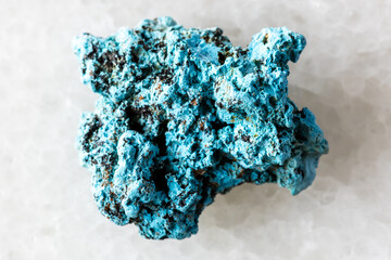 sample of rough shattuckite mineral on white