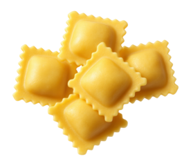Raw yellow ravioli pasta on a white background.