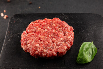 Raw cutlet meat burger ground meat beef, pork fresh natural product tasty snack delicious gourmet food background on the table rustic top view copy space