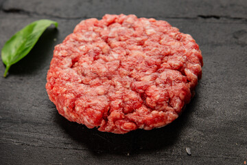 Raw cutlet meat burger ground meat beef, pork fresh natural product tasty snack delicious gourmet food background on the table rustic top view copy space