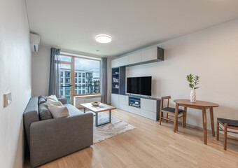 Modern Living Room Interior with Stylish Furniture and Large Window View