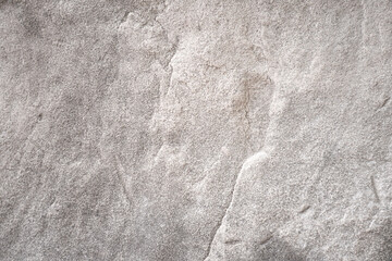 Light gray limestone with rough surface in natural cave for abstract background and stone texture. Space for work, banner, wallpaper, pattern for artwork, template or layout design.