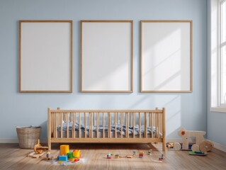 Three blank picture frames adorn a light blue nursery wall, showcasing a wooden crib and child's toys on a light brown wooden floor.