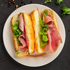 Ham sandwich green leaf salad, spam, meat snack vegetables natural product tasty tasty snack fresh delicious gourmet food background on the table rustic top view copy space