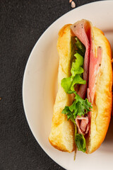 Ham sandwich green leaf salad, spam, meat snack vegetables natural product tasty tasty snack fresh delicious gourmet food background on the table rustic top view copy space