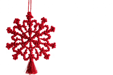 Festive red crochet snowflake ornament hanging against a transparent background for christmas season