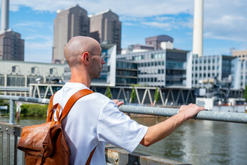 male man near Modern Mainova AG power plant in Frankfurt, Main river, gas industrial complex in metropolitan area, urban exploration, and European destinations, Travel and tourism, Frankfurt am Main
