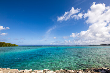 Fototapeta premium Clear Blue Ocean Water Surface with Gentle Waves Under Bright Sky