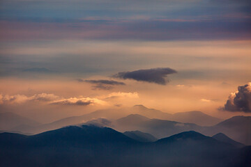 Cloud-Shrouded Mountain Peaks In Dramatic High-Altitude Landscape