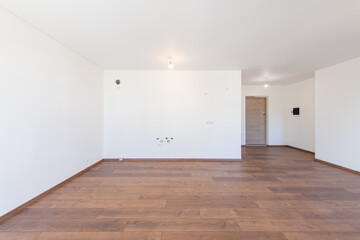 Spacious Empty Living Room With Hardwood Flooring and Minimalist Interior Design