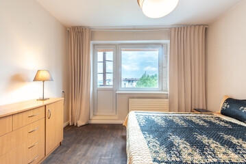 Modern Home Bedroom Interior with Wooden Furniture and Large Window