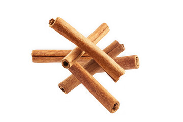 Several cinnamon sticks piled and overlapping on a black background spice bark