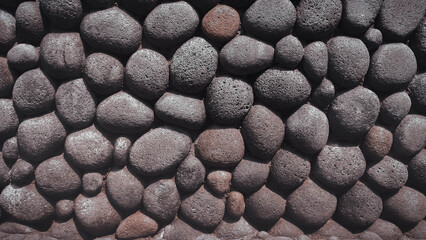 Detailed Textured Wall of Round Grey Stones