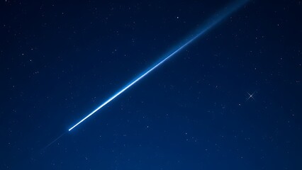 Obraz premium A brilliant meteor streak with a glowing tail in a star-filled night sky.