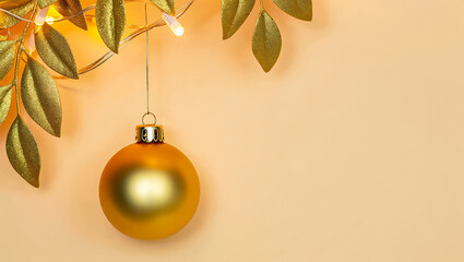 Elegant Golden Christmas Ornament Hanging with Festive String Lights and Glittery Leaves on Pastel Background Holiday Season Decor