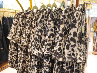 A collection of Muslim clothing for women with various designs, patterns and colors is sold in a clothing shop.