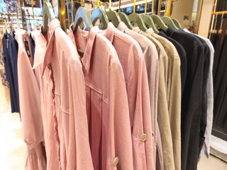 A collection of Muslim clothing for women with various designs, patterns and colors is sold in a clothing shop.